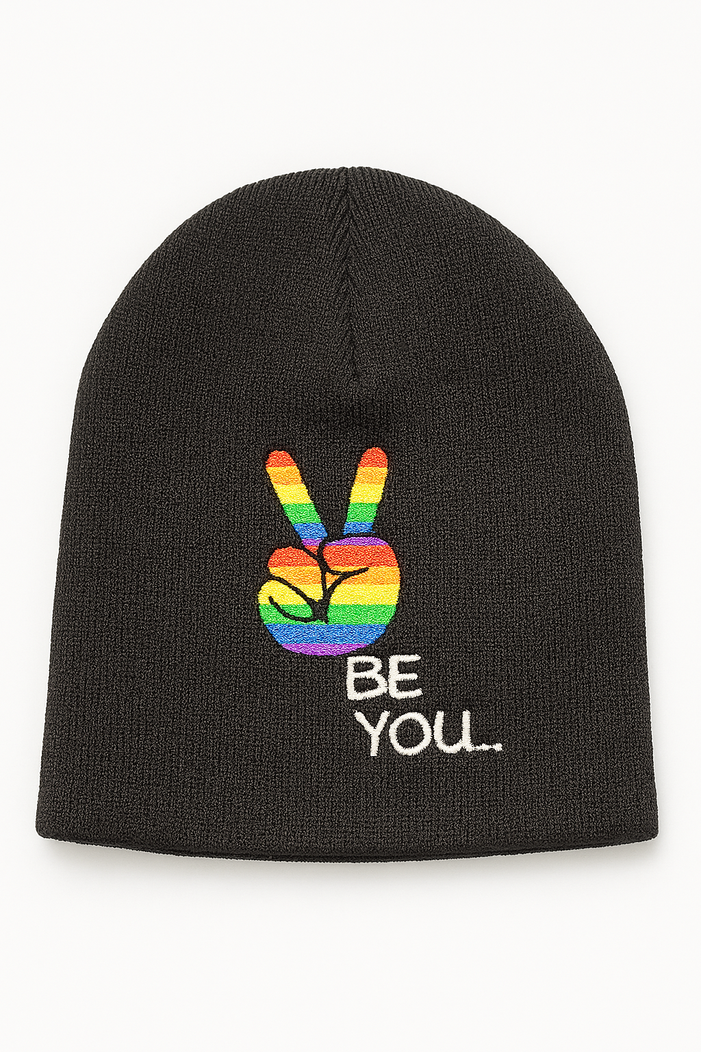 Close-up of Proud To Be Me flip-style knit beanie showing premium knit texture and reversible messages